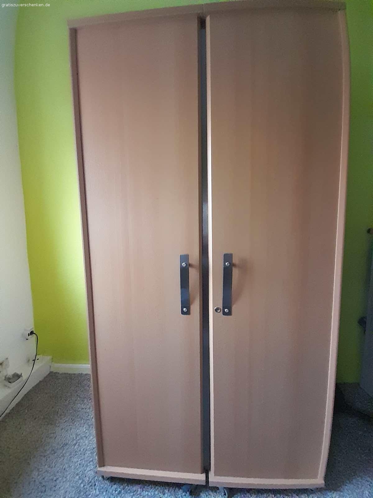 Arbeitstisch mit Flügeltüren. Für Selbstabholer zu verschenken. Abholung in Gelsenkirchen Feldmark, Nähe Altstadt.
H 195 cm, L 100–200 cm, T 75 cm.